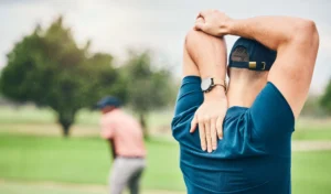 golf-sports-and-man-stretching-arms-on-course