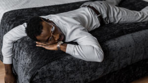 exhausted-african-american-man-in-formal-wear-sleep